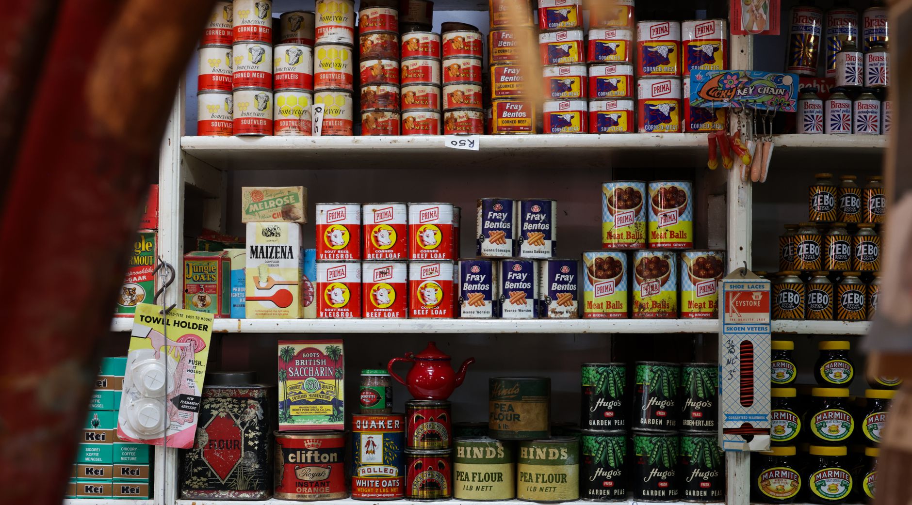 Shelves stocked with tins and essentials at a UK food bank, reflecting the growing pressure of food bank demand